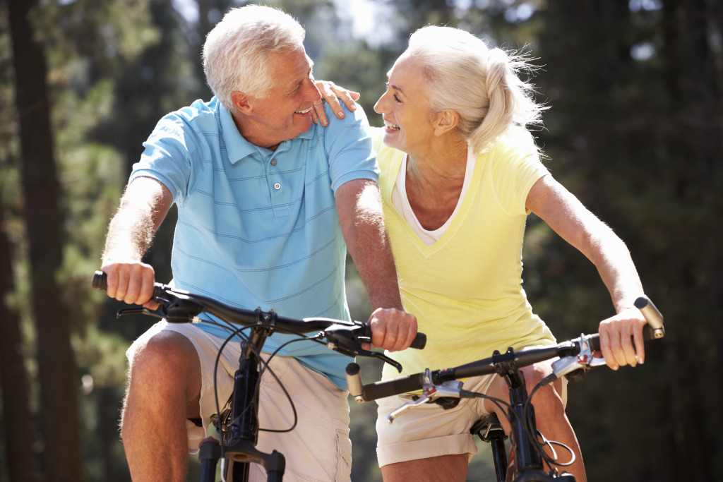 elderly people on a bike